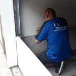 garage door technication replacing a door near dallas tx 150x150
